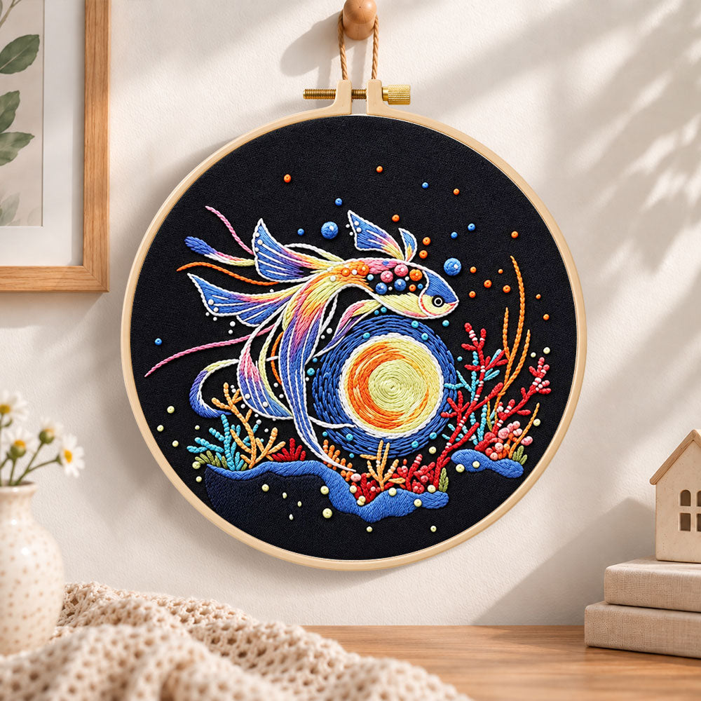 Cosmic betta fish embroidery hoop wall art displayed as warm and cozy handmade home decor