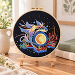 Cosmic betta fish embroidery kit finished hoop displayed on a wooden stand as cozy tabletop decor