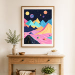 Finished cosmic colorful mountain range cross stitch artwork displayed as home decor