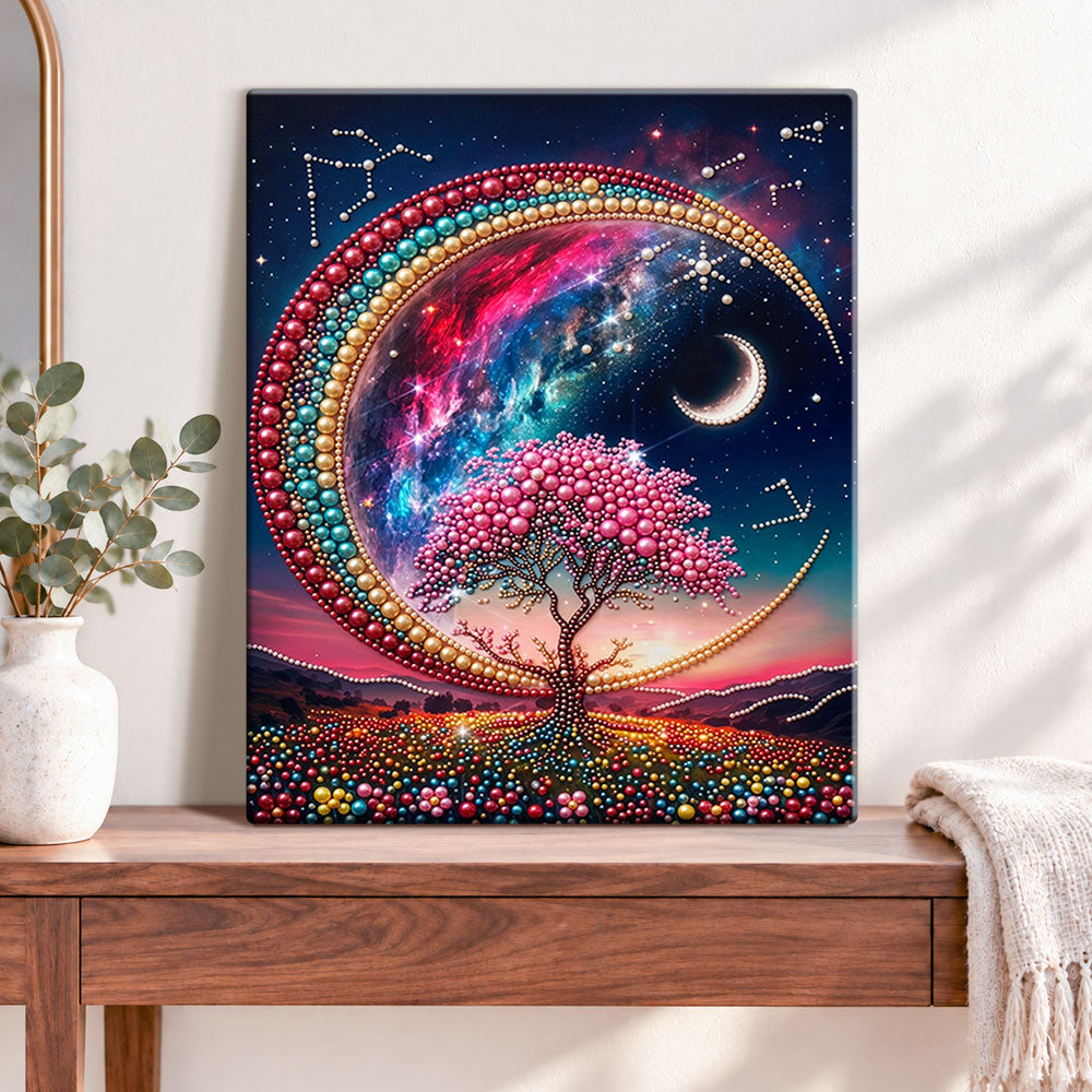 Finished cosmic moon and tree pearl diamond painting artwork displayed as home decor