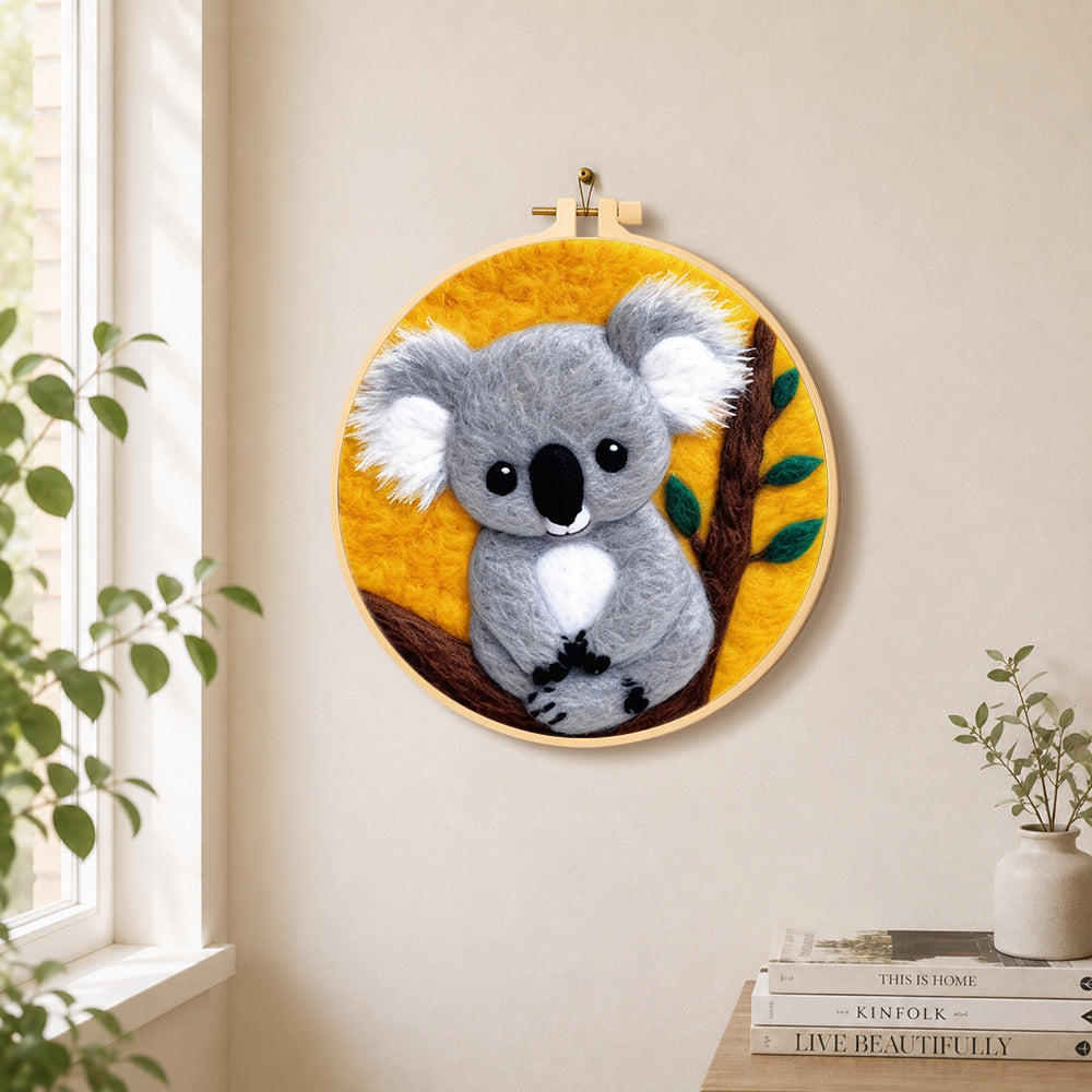 Cosy gray koala needle felt wall art displayed in a bright home interior