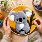 Creating the cosy gray koala wool painting by hand with a felting needle