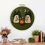 Finished cosy night camping ghosts artwork displayed on a wall