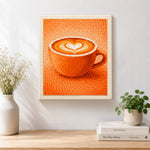 Finished cosy orange coffee cup with heart latte art artwork displayed on a wall