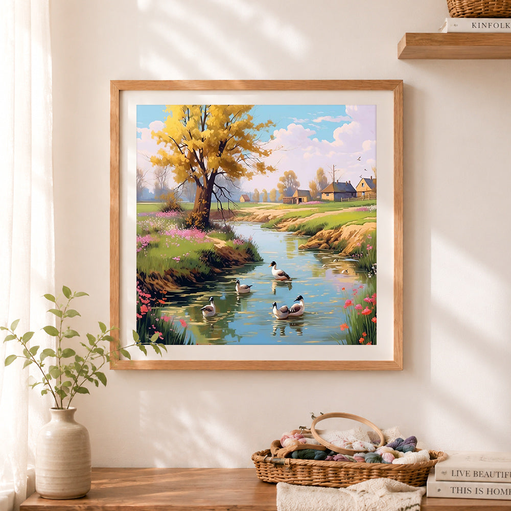 Finished country creek with ducks cross stitch artwork displayed as home decor
