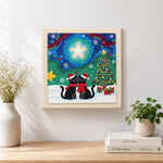 Finished couple black cats xmas artwork displayed on a wall