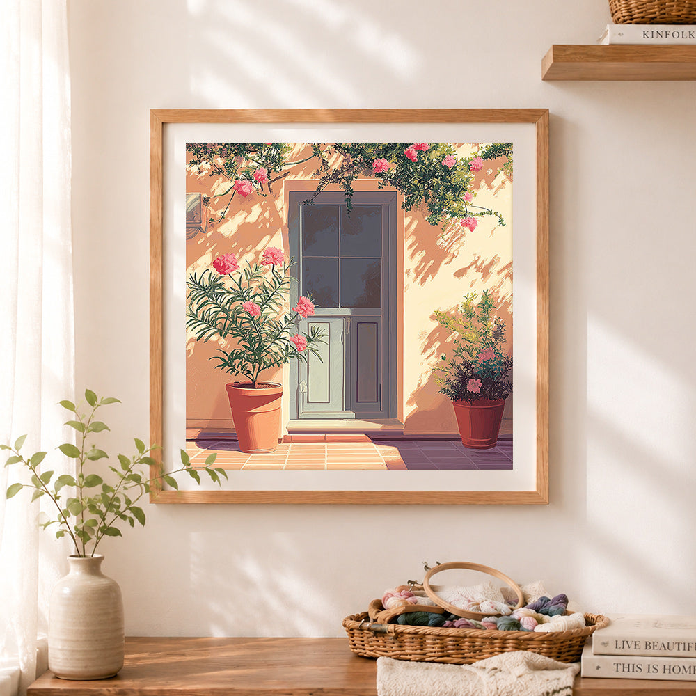 Finished courtyard floral scene cross stitch artwork displayed as home decor