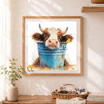 Finished cow in metal bucket cross stitch artwork displayed as home decor