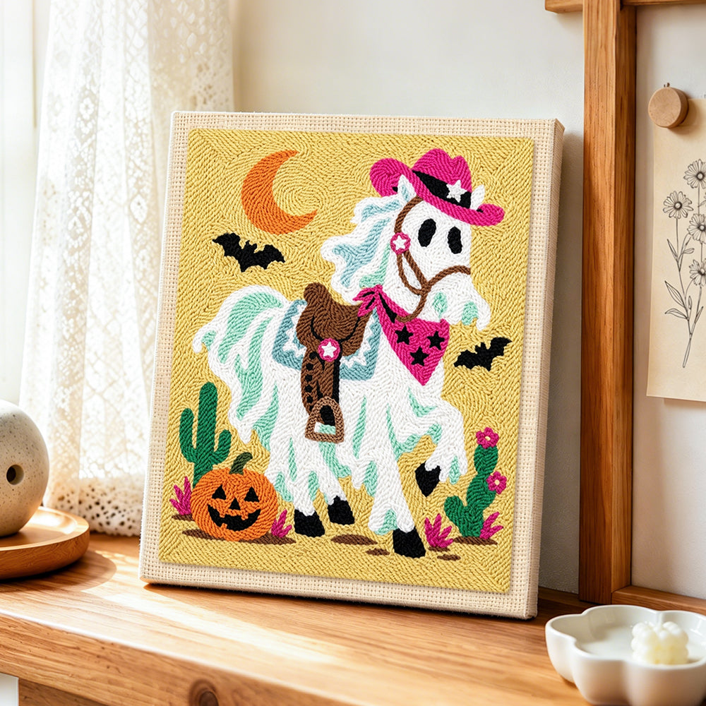 Cowboy ghost horse punch needle artwork displayed on a table