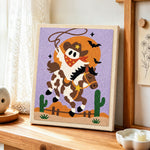 Cowboy ghost riding horse punch needle artwork displayed on a table