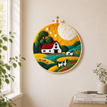 Cows and farm life needle felt wall art displayed in a bright home interior