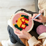 Creating handmade cozy christmas cabin unch needle artwork