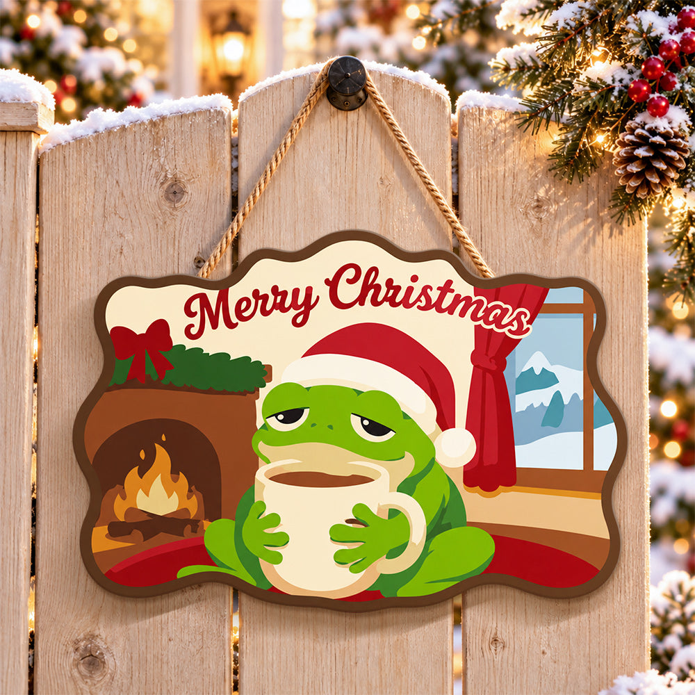 Cozy frog holiday paint by numbers door hanger on a garden gate
