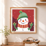 Finished cozy holiday snowman art cross stitch artwork displayed as home decor