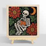 Cozy skeleton holding pumpkin punch needle kit for beginners