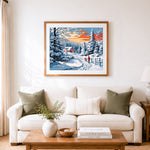 Finished cozy winter cabin walk cross stitch artwork displayed as home decor