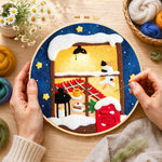 Creating the cozy winter window wool painting by hand with a felting needle