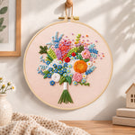 Cream wildflower bouquet embroidery hoop wall art displayed as warm and cozy handmade home decor