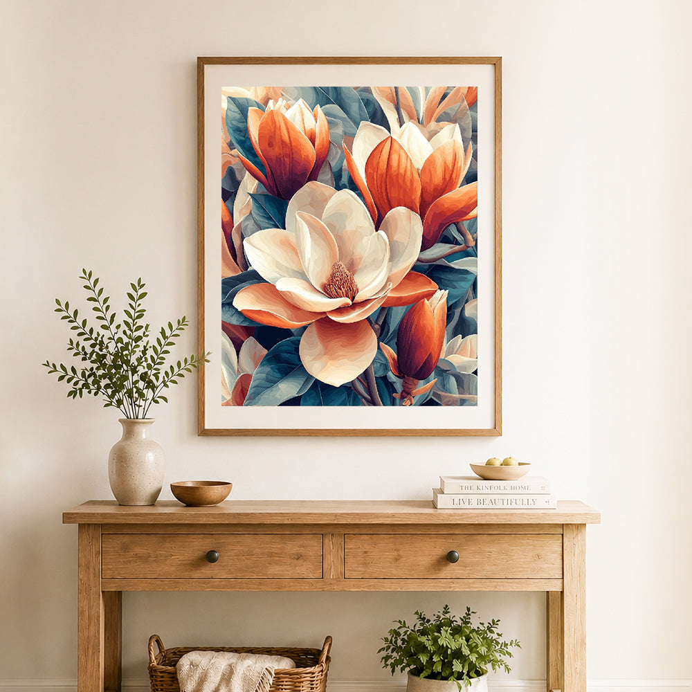 Finished creamy magnolia blooms cross stitch artwork displayed as home decor