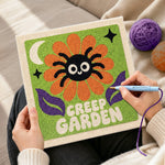 Creating handmade creep garden spider flower punch needle artwork