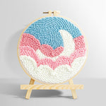 Crescent moon over pink and white clouds punch needle kit for beginners