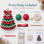 Everything included in the DIY Crochet Christmas Tree Kit including yarn, crochet hook, needles, pearls, ribbon, wooden base and instructions