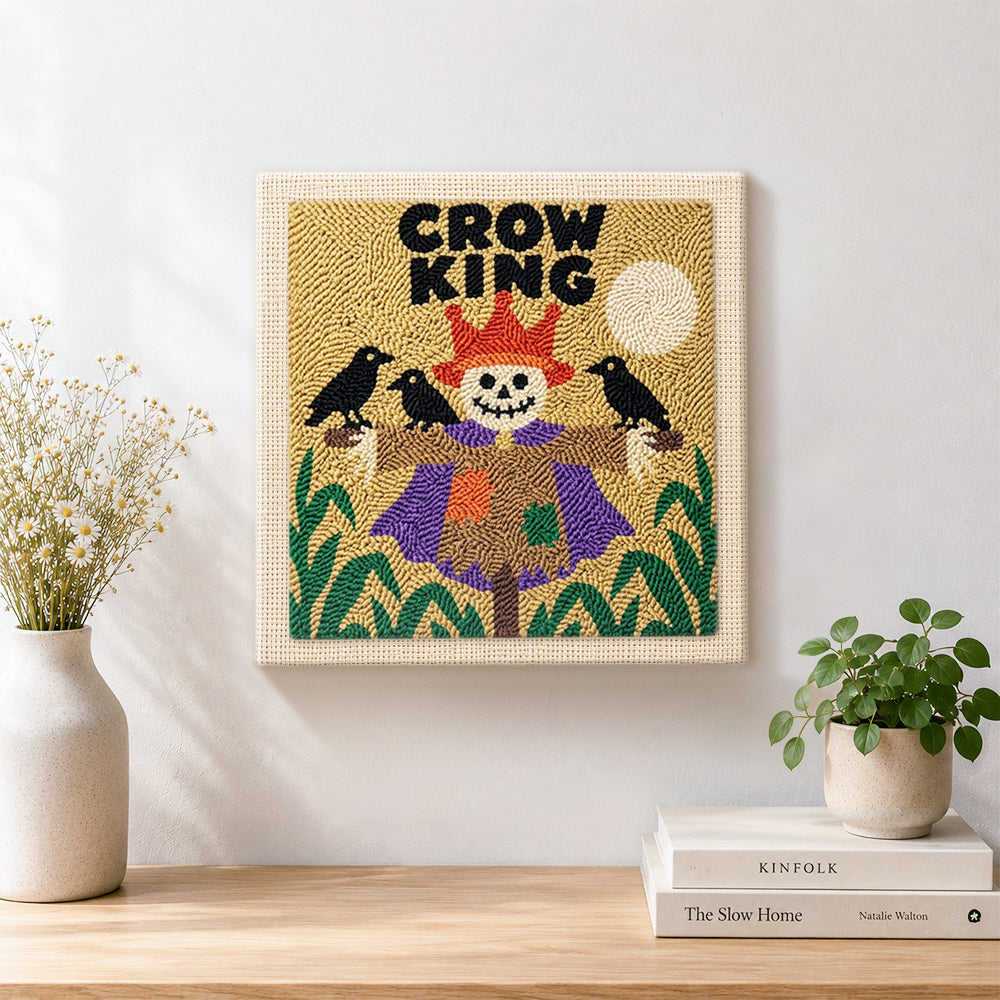 Finished crow king scarecrow artwork displayed on a wall
