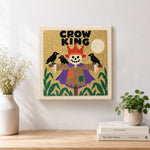Finished crow king scarecrow artwork displayed on a wall