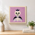 Finished crown skeleton artwork displayed on a wall