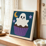 Cupcake ghost punch needle artwork displayed on a table