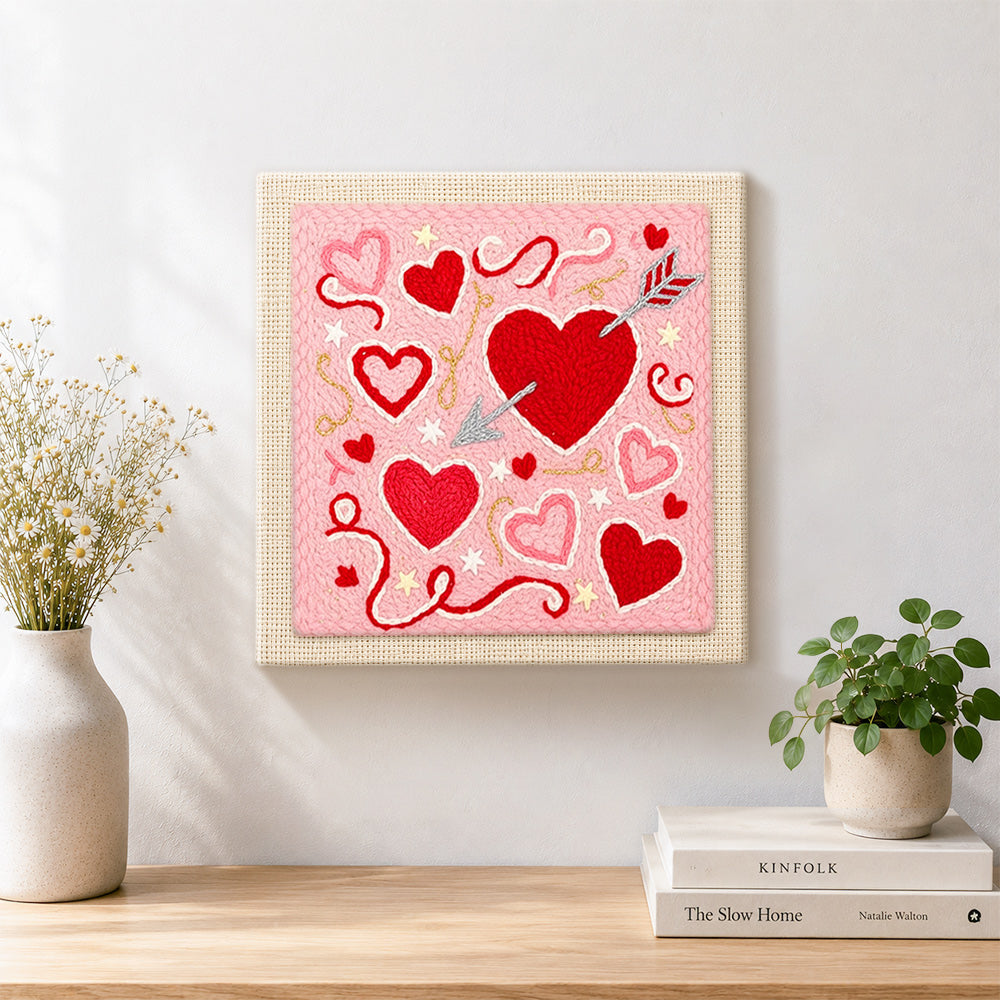 Finished cupid's arrow target heart artwork displayed on a wall