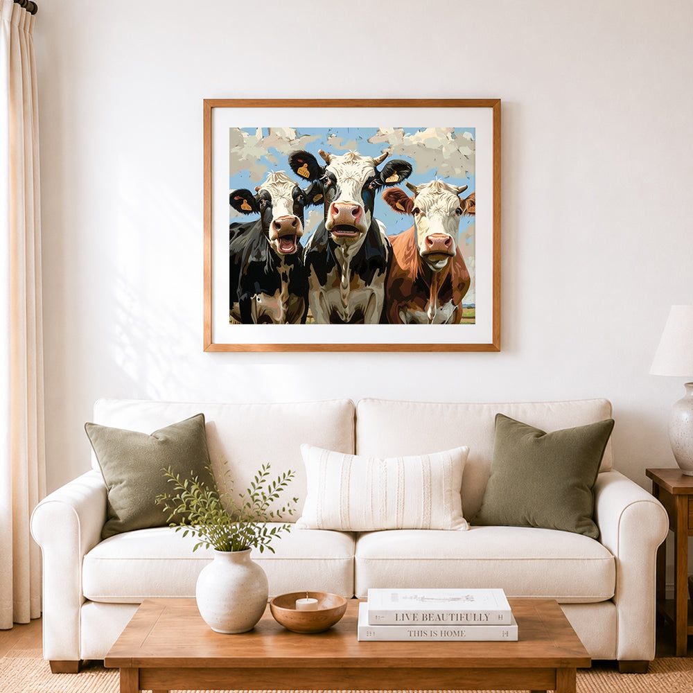 Finished curious three cows cross stitch artwork displayed as home decor