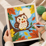 Creating handmade cute autumn owl on branch punch needle artwork