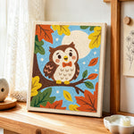 Cute autumn owl on branch punch needle artwork displayed on a table