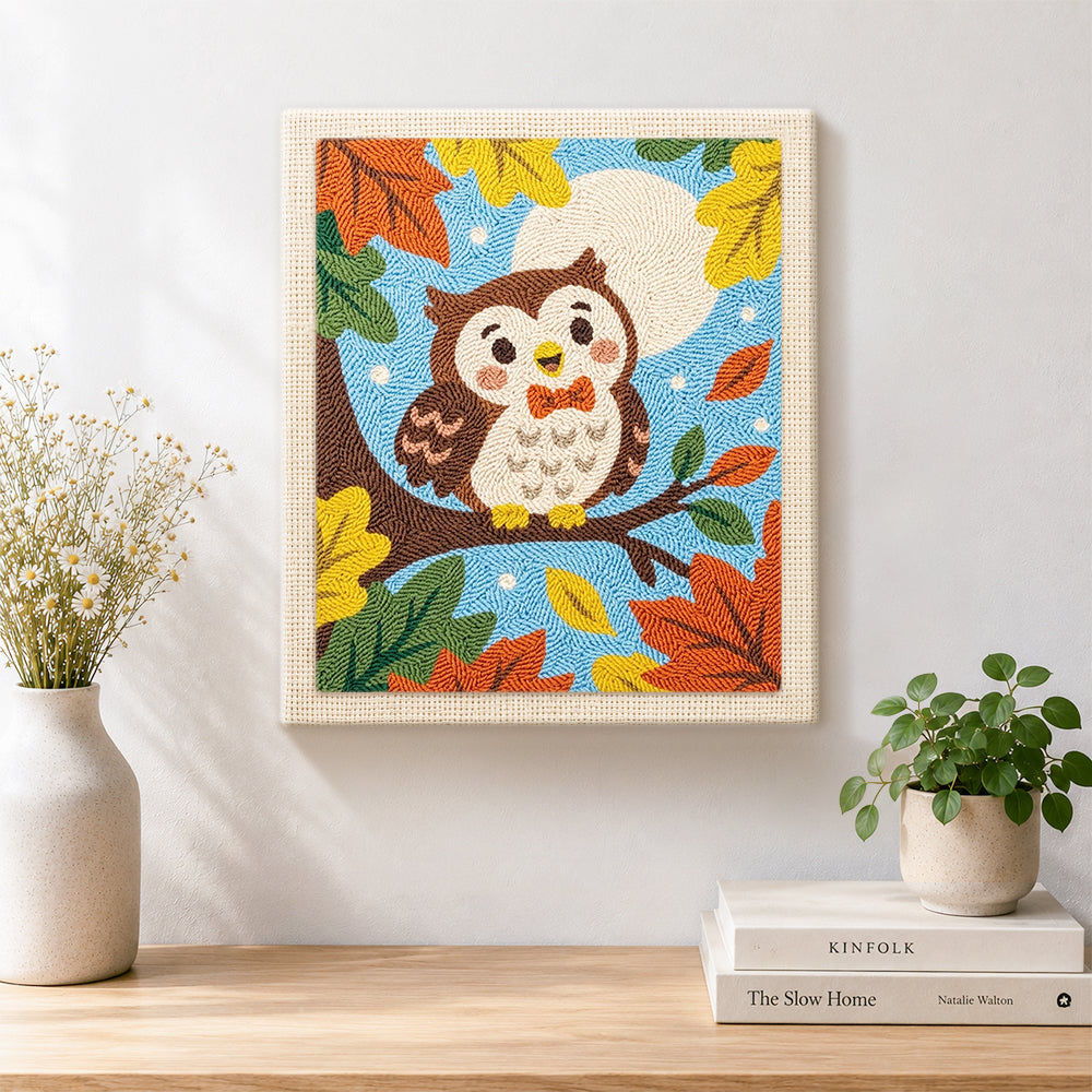 Finished cute autumn owl on branch artwork displayed on a wall
