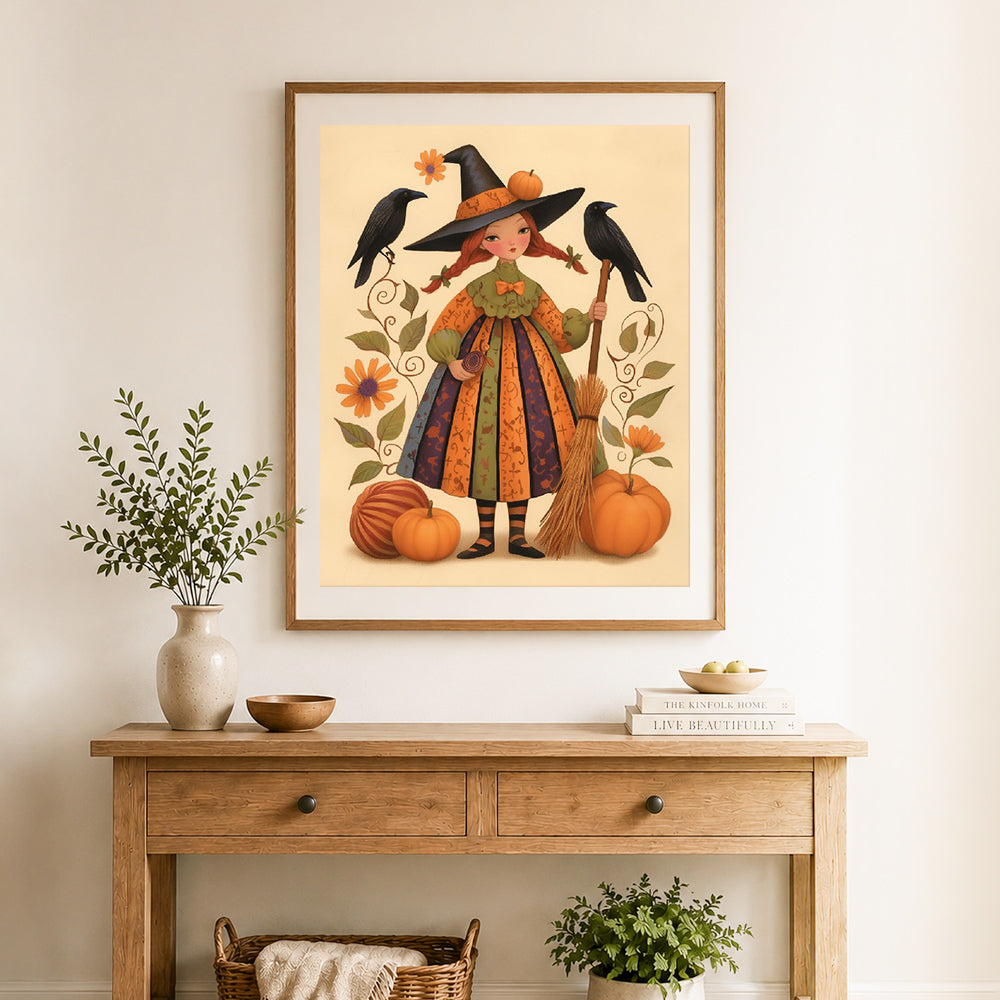 Finished cute autumn witch cross stitch artwork displayed as home decor