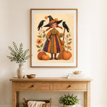 Finished cute autumn witch cross stitch artwork displayed as home decor