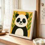 Cute bamboo panda punch needle artwork displayed on a table