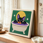 Cute bat taking bath punch needle artwork displayed on a table