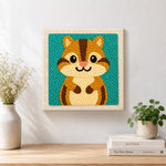 Finished cute big-eyed chipmunk artwork displayed on a wall