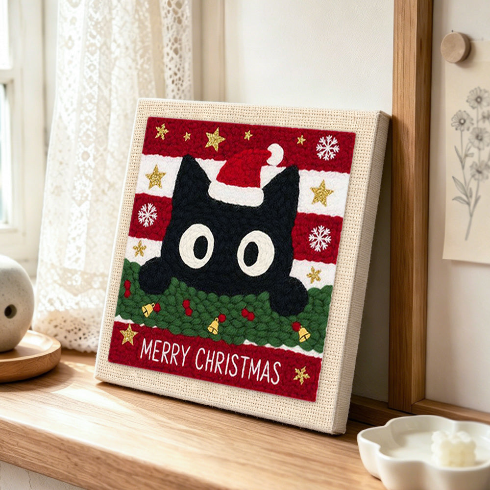 Cute black cat christmas portrait punch needle artwork displayed on a table