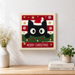Finished cute black cat christmas portrait artwork displayed on a wall