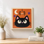 Finished cute black cat artwork displayed on a wall