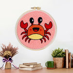 Finished cute cartoon crab artwork displayed on a wall