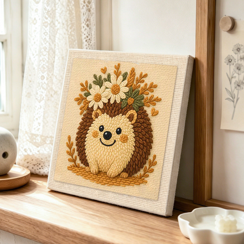 Cute floral crown hedgehog punch needle artwork displayed on a table