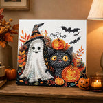Finished cute ghost and black cat pearl diamond painting artwork displayed as holiday home decor