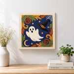 Finished cute ghost and witch hat design artwork displayed on a wall