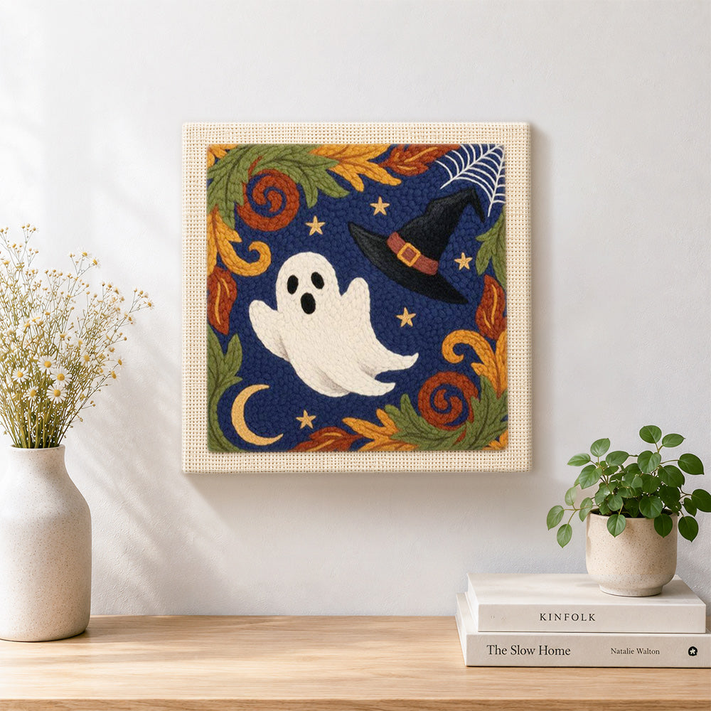 Finished cute ghost and witch hat design artwork displayed on a wall