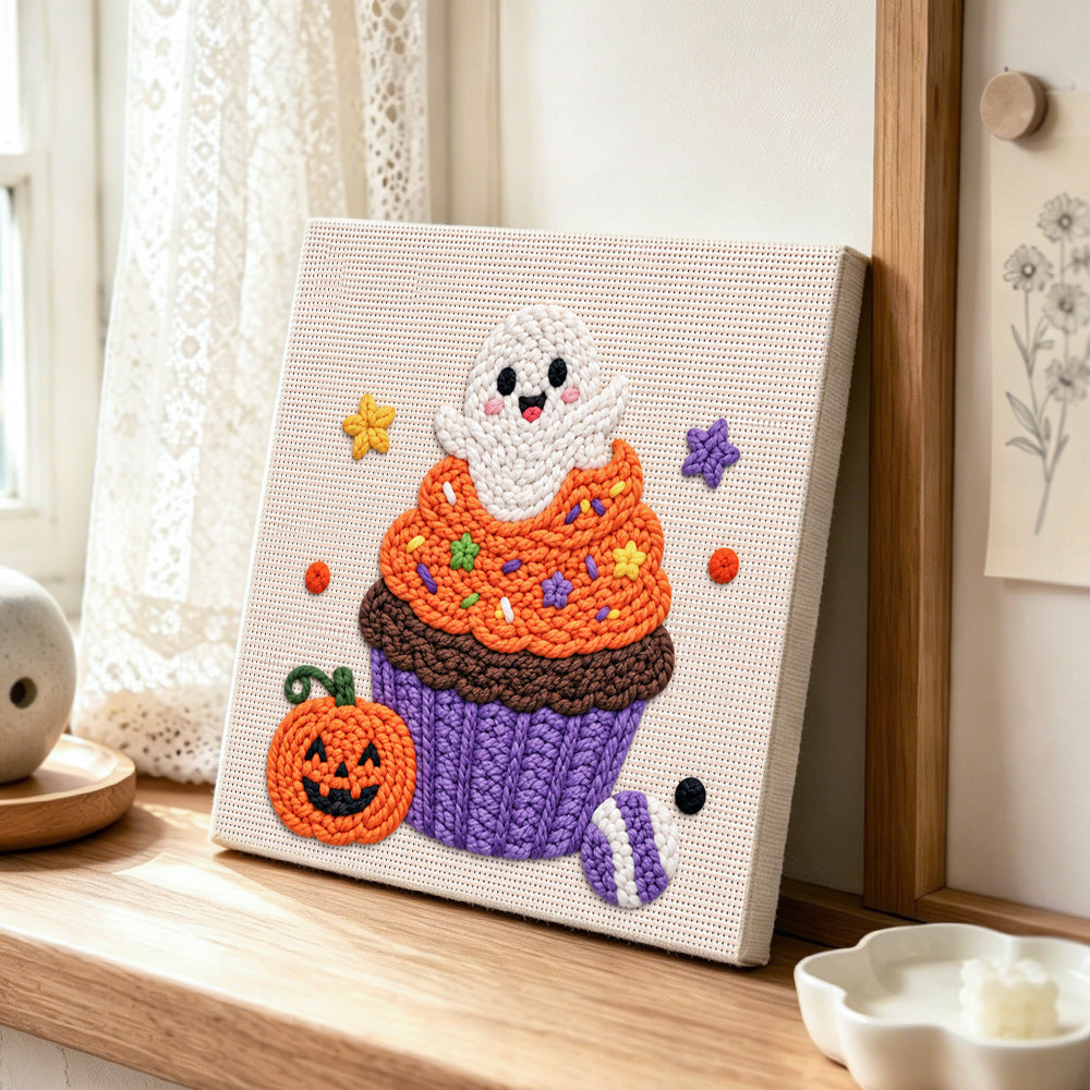 Cute ghost cupcake punch needle artwork displayed on a table