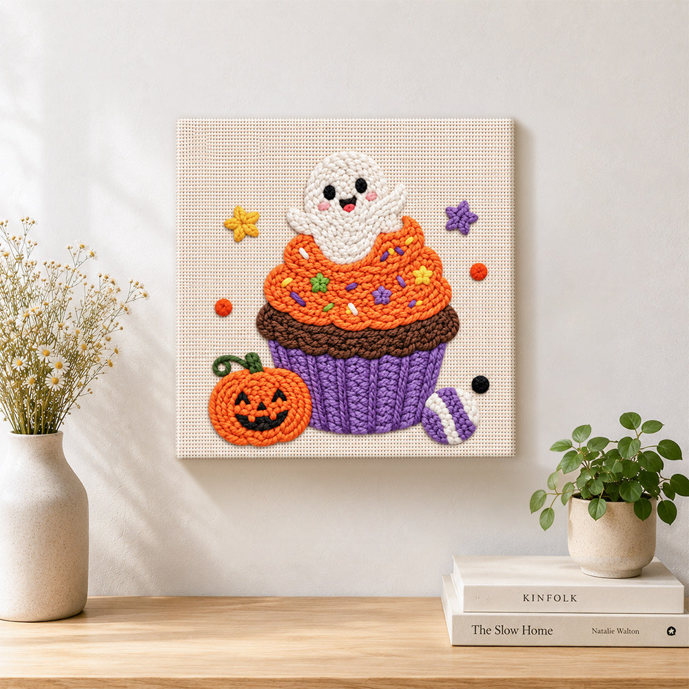 Finished cute ghost cupcake artwork displayed on a wall
